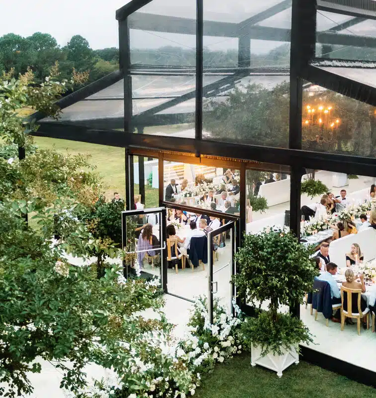 A clearspan tented venue hosts a stylish corporate gathering.