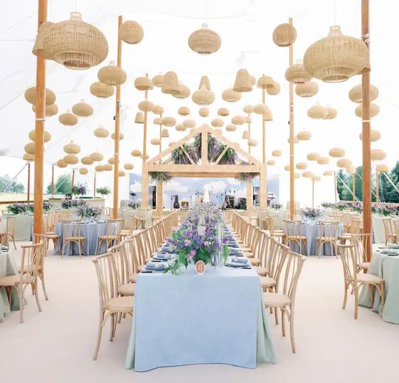 Century Pole Tent interior showcases high ceilings, wooden support poles, and custom lighting, ideal for upscale event layouts, airflow, and elegant aesthetics.