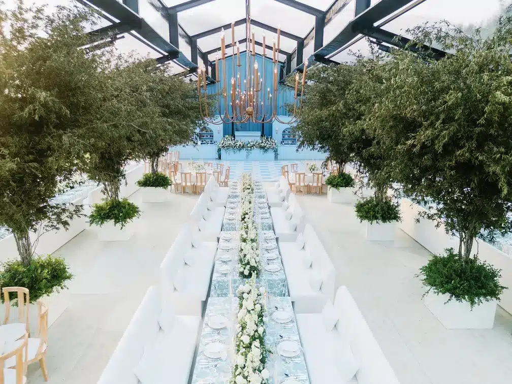 Elegant frame tent with exposed black aluminum beams and clear vinyl panels, showcasing durable materials used for structural strength and long-lasting event performance.