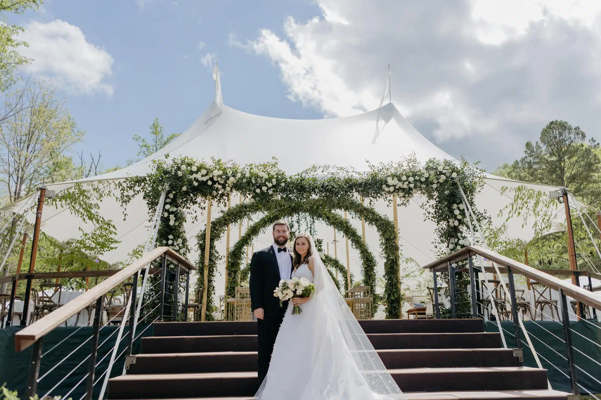 Romantic wedding tent with crystal chandeliers and ambient lighting