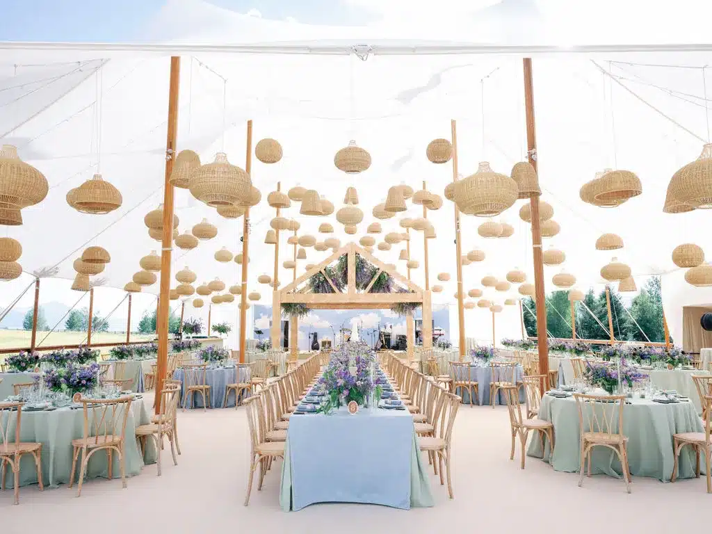 Luxury wedding tent with chandeliers and draping