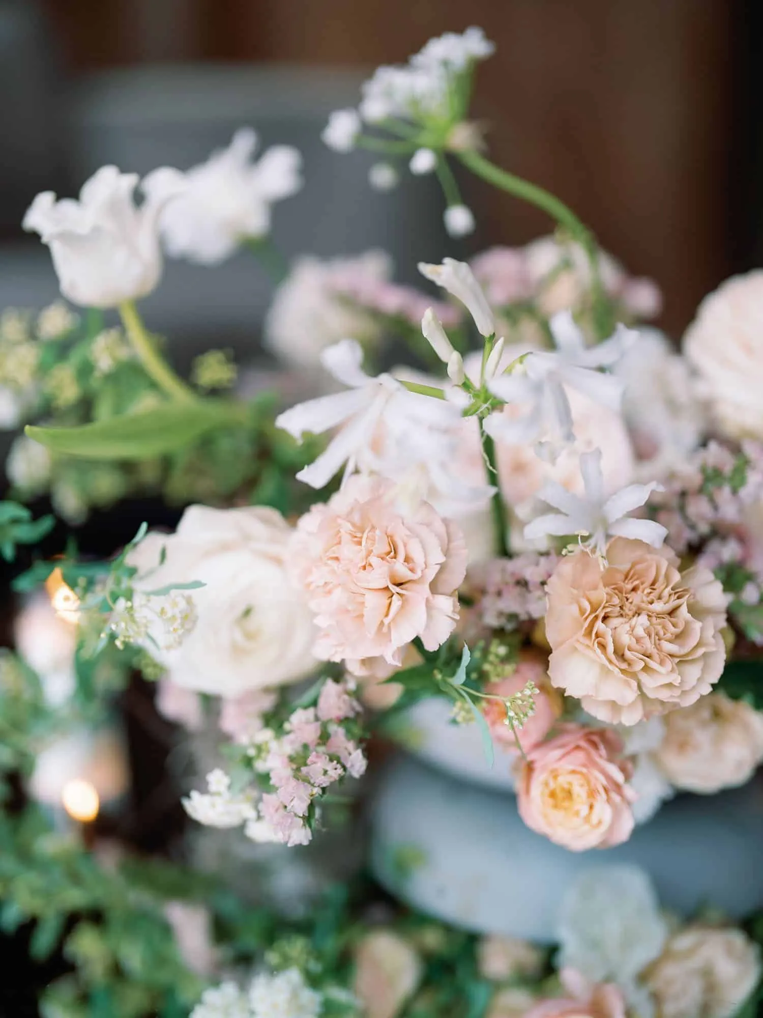 Romantic wedding floral centerpiece with soft pastel blooms and delicate textures for intimate decor