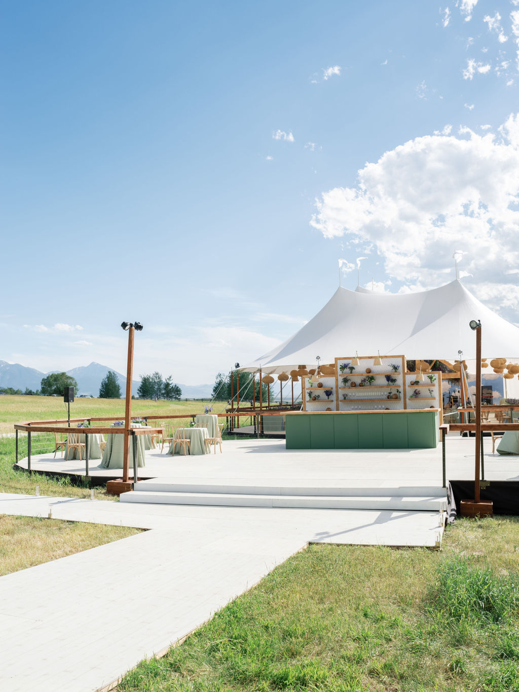 Executive event tent setup outdoors with refined layout and branding elements