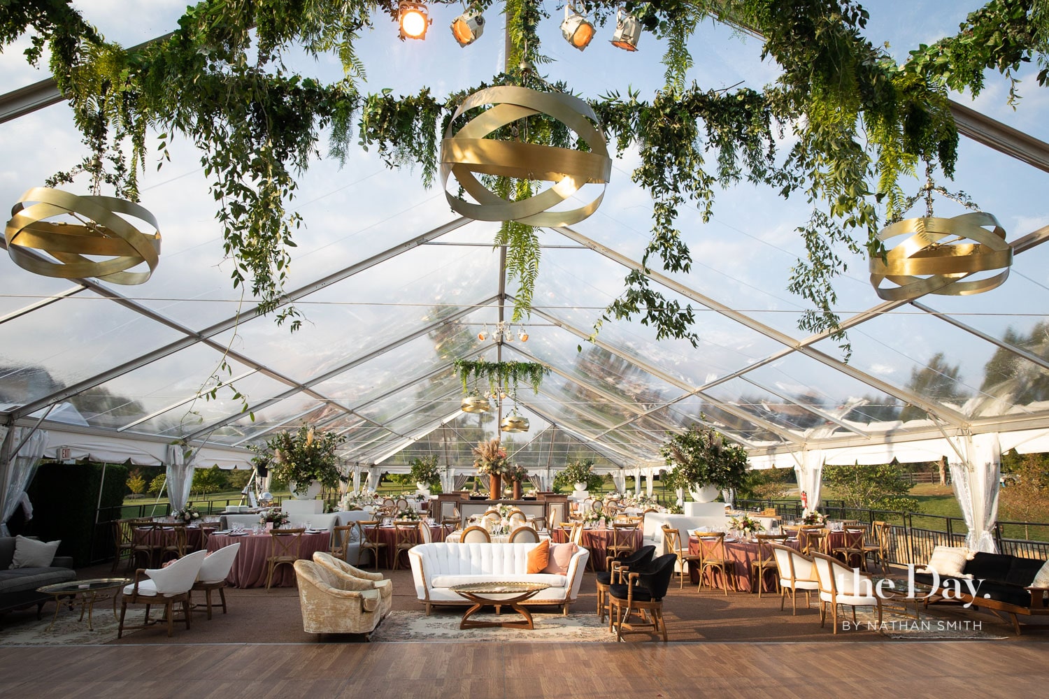 Outdoor business event tent with structured layout and lighting design
