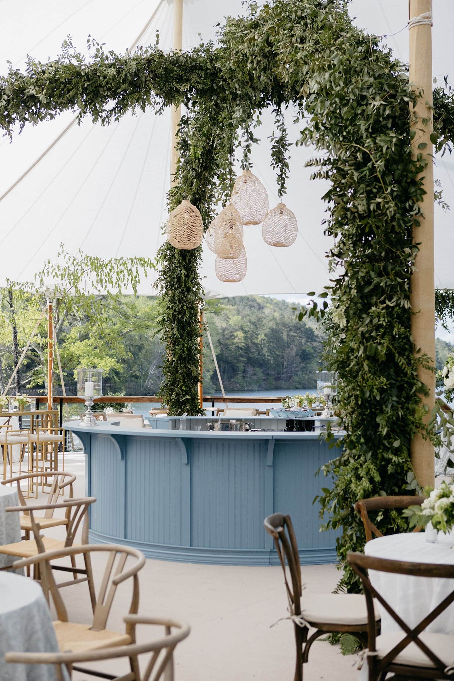 Romantic outdoor wedding tent with floral installations