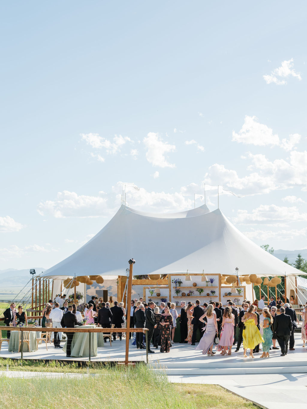 Corporate event tent in summer with stage and presentation setup
