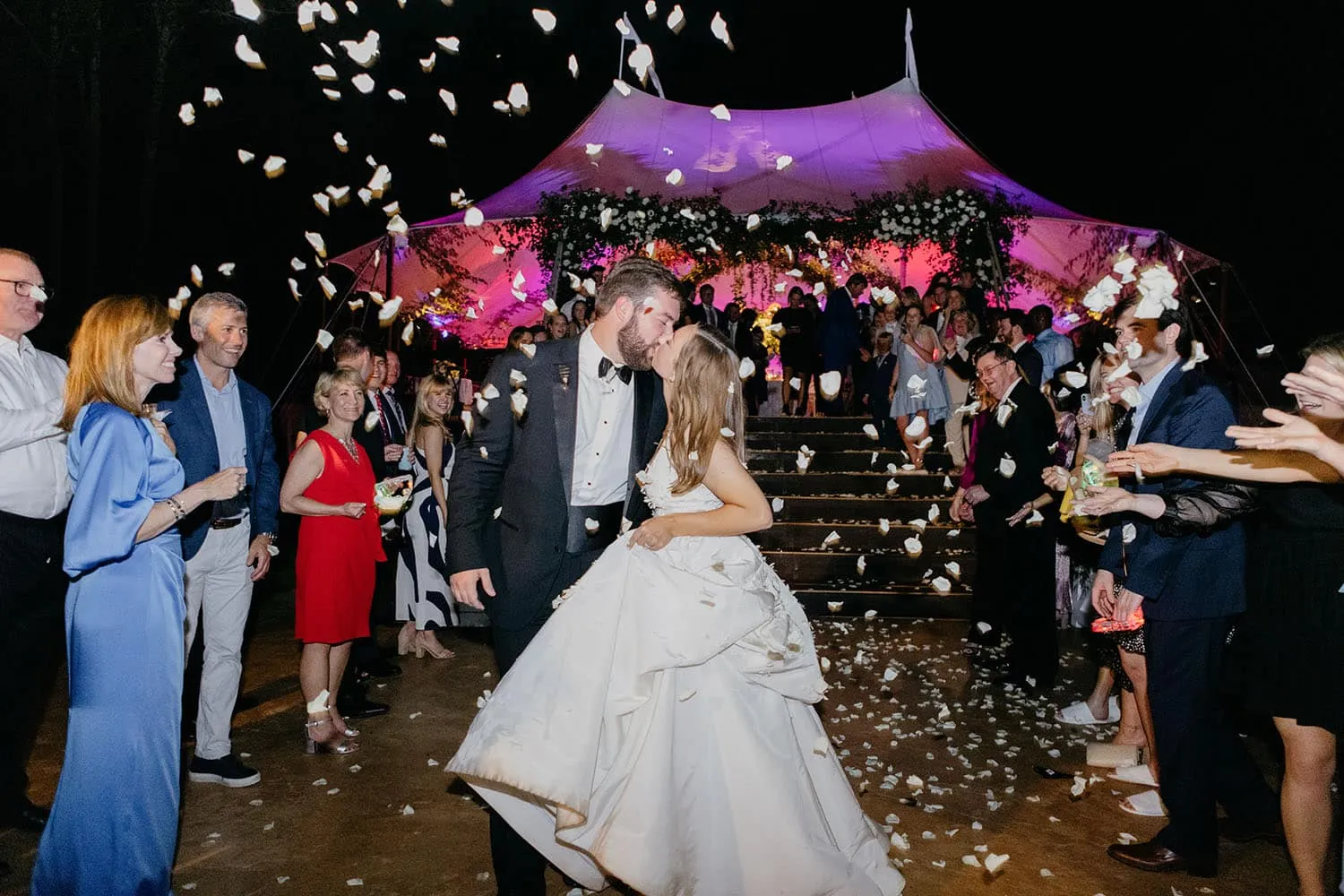 Autumn wedding reception inside a glowing sailcloth tent